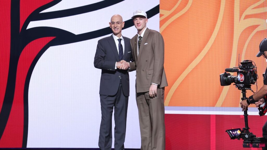 Kasparas Jakucionis stands with NBA commissioner Adam Silver after being selected as the 20th pick by the Miami Heat in the first round of the 2025 NBA Draft at Barclays Center.