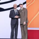 Kasparas Jakucionis stands with NBA commissioner Adam Silver after being selected as the 20th pick by the Miami Heat in the first round of the 2025 NBA Draft at Barclays Center.