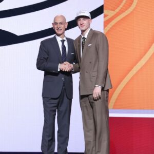 Kasparas Jakucionis stands with NBA commissioner Adam Silver after being selected as the 20th pick by the Miami Heat in the first round of the 2025 NBA Draft at Barclays Center.