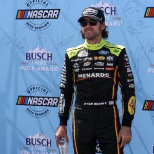 NASCAR Cup Series driver Ryan Blaney (12) stands with the Busch Light Pole Award after winning the pole for the Go Bowling at The Glen at Watkins Glen International.