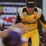 NASCAR Cup Series driver Christopher Bell (20) shakes hands with fans during driver introductions prior to the NASCAR Cup Series Cook Out 400 at Richmond Raceway.