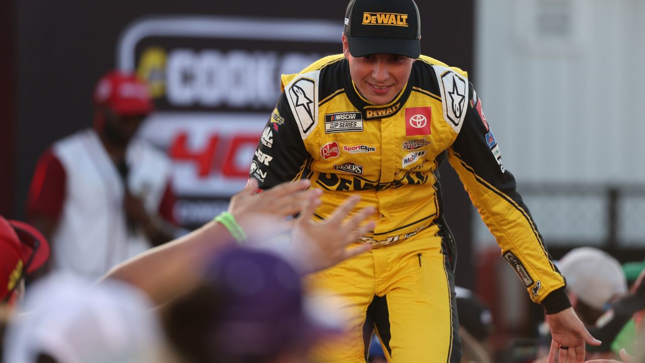 NASCAR Cup Series driver Christopher Bell (20) shakes hands with fans during driver introductions prior to the NASCAR Cup Series Cook Out 400 at Richmond Raceway.