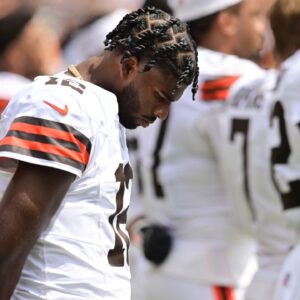 Cleveland Browns quarterback Shedeur Sanders (12) listens to the national anthem before the game between the Browns and the Los Angeles Rams at Huntington Bank Field.