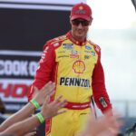 NASCAR Cup Series driver Joey Logano (22) shakes hands with fans during driver introductions prior to the NASCAR Cup Series Cook Out 400 at Richmond Raceway.