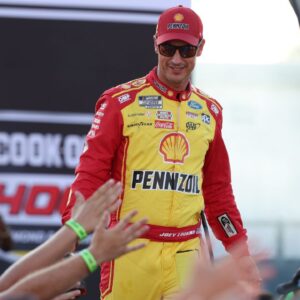 NASCAR Cup Series driver Joey Logano (22) shakes hands with fans during driver introductions prior to the NASCAR Cup Series Cook Out 400 at Richmond Raceway.