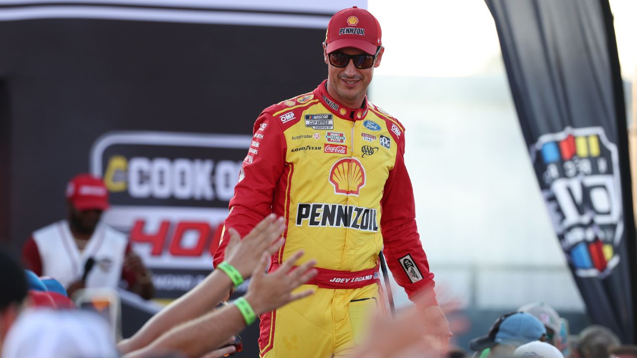 NASCAR Cup Series driver Joey Logano (22) shakes hands with fans during driver introductions prior to the NASCAR Cup Series Cook Out 400 at Richmond Raceway.