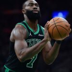May 14, 2025; Boston, Massachusetts, USA; Boston Celtics guard Jaylen Brown (7) shoots a free throw in the second half during game five of the second round for the 2025 NBA Playoffs against the New York Knicks at TD Garden.