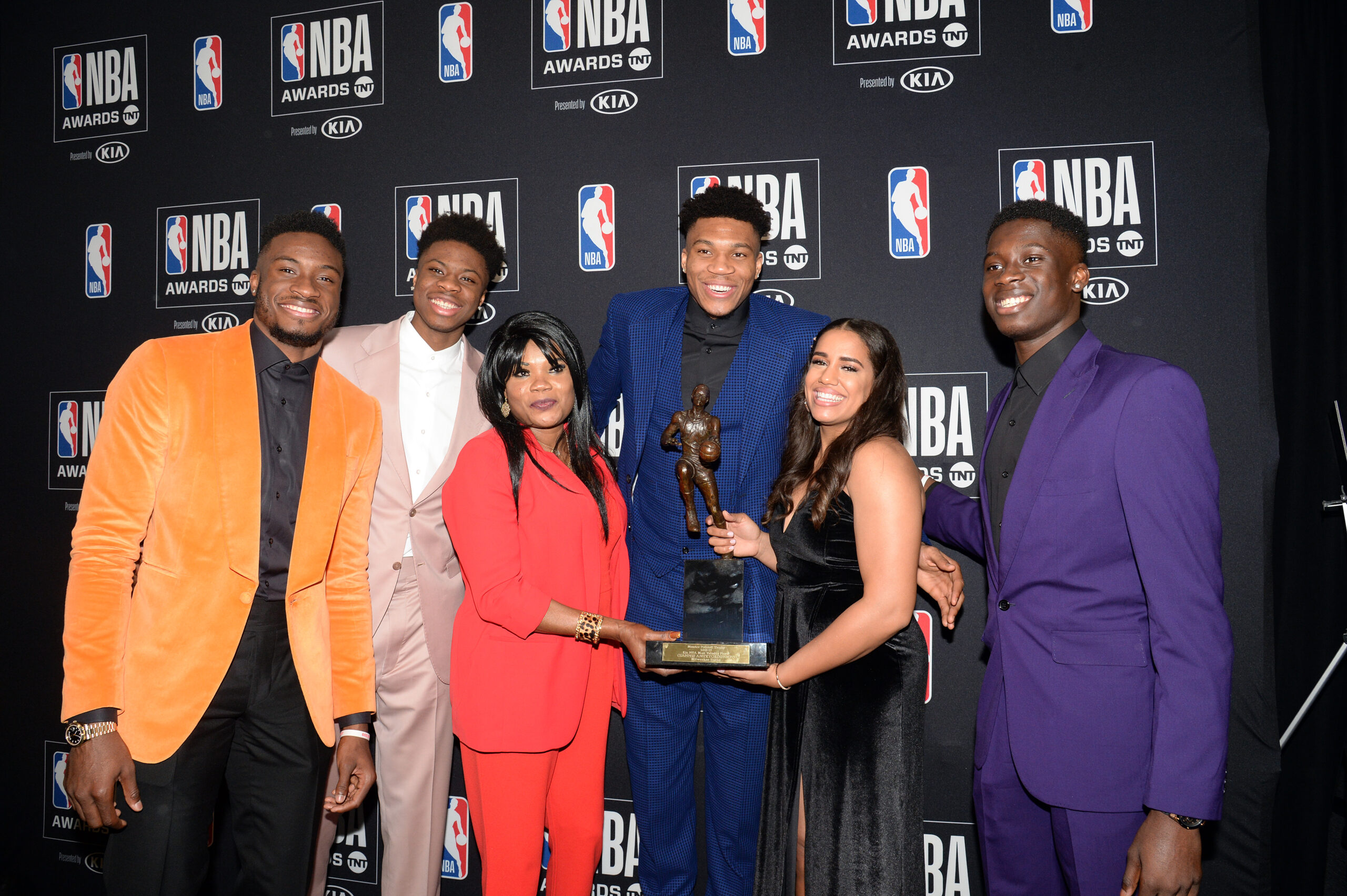 June 24, 2019; Los Angeles, CA, USA; Milwaukee Bucks forward Giannis Antetokounmpo poses with his family following his award of the NBA most valuable player at the 2019 NBA Awards show at Barker Hanger. Mandatory Credit: Gary A. Vasquez-Imagn Images
