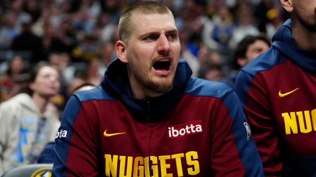Mar 15, 2025; Denver, Colorado, USA; Denver Nuggets center Nikola Jokic (15) reacts from the bench in the second quarter against the Washington Wizards at Ball Arena