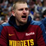 Mar 15, 2025; Denver, Colorado, USA; Denver Nuggets center Nikola Jokic (15) reacts from the bench in the second quarter against the Washington Wizards at Ball Arena