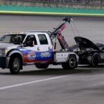 Monster Energy NASCAR Cup Series driver J.J. Yeley (23) is towed off the track during the NASCAR Monster Energy Cup Series Quaker State 400 race, Saturday, July 14, 2018, at the Kentucky Speedway in Sparta, Ky.