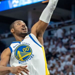 Golden State Warriors forward Jonathan Kuminga (00) drives to the basket against the Minnesota Timberwolves in the second half during game five of the second round for the 2025 NBA Playoffs at Target Center.