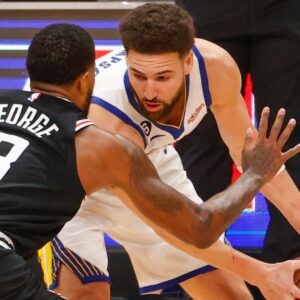February 14, 2023, Los Angeles, California, USA: Golden State Warriors guard Klay Thompson (11) is defended by Los Angeles Clippers forward Paul George (13)