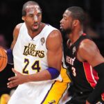 Los Angeles Lakers shooting guard Kobe Bryant (24) controls the ball against the defense of Miami Heat shooting guard Dwyane Wade (3) during the first half at Staples Center.