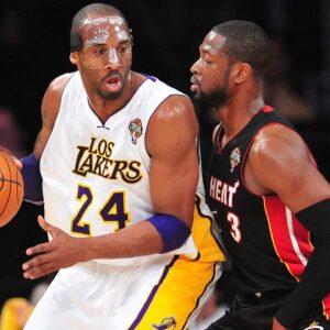Los Angeles Lakers shooting guard Kobe Bryant (24) controls the ball against the defense of Miami Heat shooting guard Dwyane Wade (3) during the first half at Staples Center.
