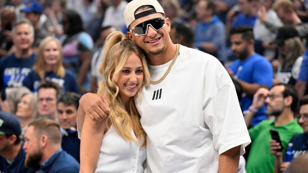 Kansas City Chiefs quarterback Patrick Mahomes and Brittany Mahomes pose in the first half between the Dallas Mavericks and the Minnesota Timberwolves during game three of the western conference finals for the 2024 NBA playoffs at American Airlines Center.