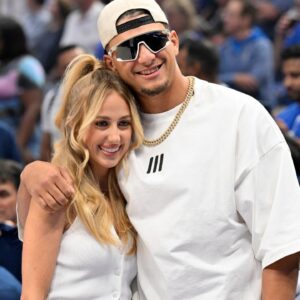 Kansas City Chiefs quarterback Patrick Mahomes and Brittany Mahomes pose in the first half between the Dallas Mavericks and the Minnesota Timberwolves during game three of the western conference finals for the 2024 NBA playoffs at American Airlines Center.