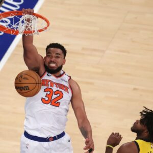 New York Knicks center Karl-Anthony Towns (32) dunks against Indiana Pacers forward Jarace Walker (5) in the fourth quarter during game five of the eastern conference finals for the 2025 NBA Playoffs at Madison Square Garden.