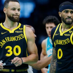 Mar 29, 2024; Charlotte, North Carolina, USA; Golden State Warriors guards Stephen Curry (30) and Gary Payton II look to the bench during a break in the action against the Charlotte Hornets during the first quarter at Spectrum Center.