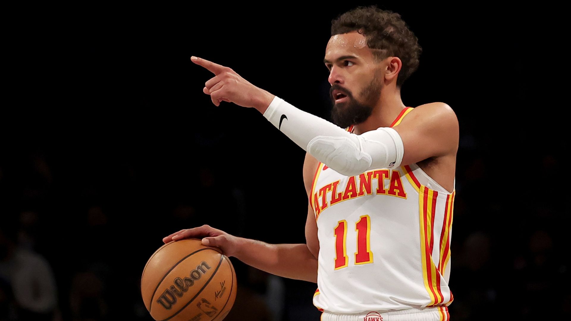 Apr 10, 2025; Brooklyn, New York, USA; Atlanta Hawks guard Trae Young (11) controls the ball against the Brooklyn Nets during the third quarter at Barclays Center.