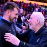Feb 23, 2023; Dallas, Texas, USA; Dallas Mavericks guard Luka Doncic (left) talks with San Antonio Spurs head coach Gregg Popovich (right) after the game at the American Airlines Center. Mandatory Credit: Jerome Miron-Imagn Images