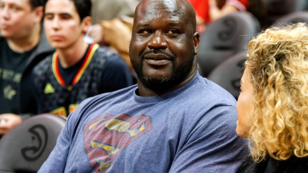 NBA former player Shaquille O'Neal watches a game between the Atlanta Hawks and Toronto Raptors in the third quarter at Philips Arena. The Hawks won 105-99.