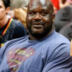 NBA former player Shaquille O'Neal watches a game between the Atlanta Hawks and Toronto Raptors in the third quarter at Philips Arena. The Hawks won 105-99.