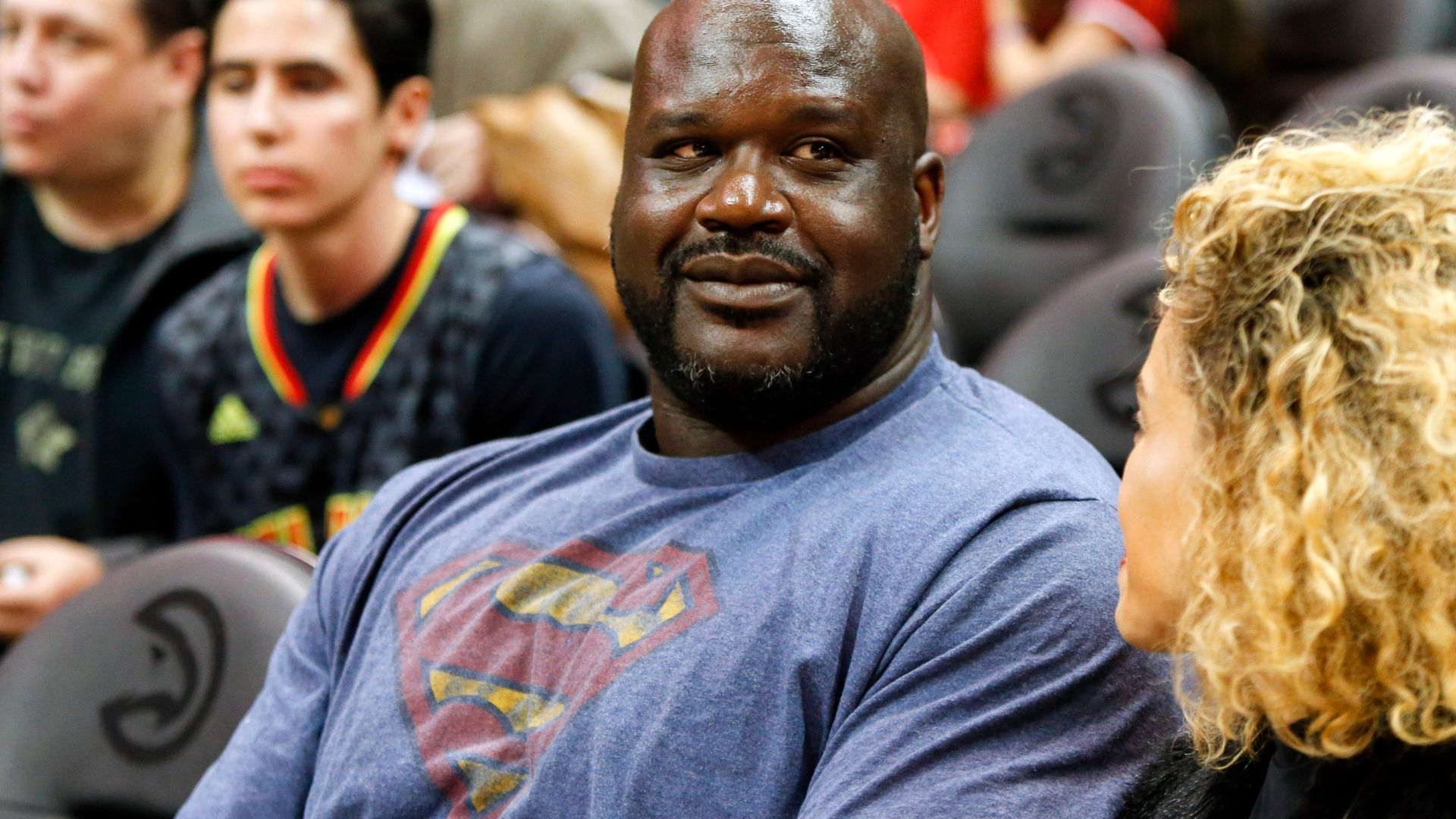 NBA former player Shaquille O'Neal watches a game between the Atlanta Hawks and Toronto Raptors in the third quarter at Philips Arena. The Hawks won 105-99.