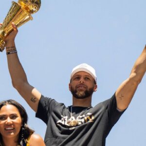 Ayesha Curry and Steph Curry celebrate on a float during the Golden State Warriors Championship Parade in San Francisco, California