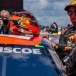 NASCAR Cup Series driver Chase Briscoe (19) climbs into his car Sunday, July 27, 2025, ahead of the Brickyard 400 at Indianapolis Motor Speedway.
