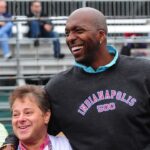 NBA retired basketball player John Salley (right) greets fans at the Indianapolis Motor Speedway.