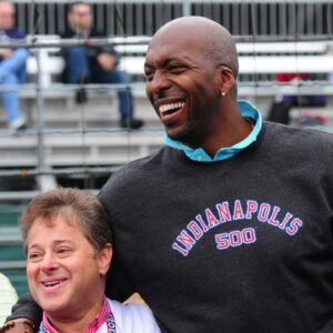 NBA retired basketball player John Salley (right) greets fans at the Indianapolis Motor Speedway.