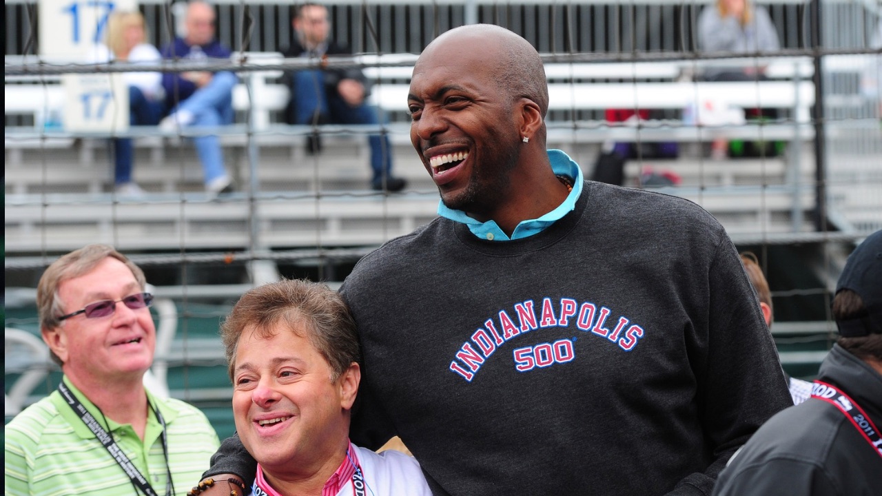 NBA retired basketball player John Salley (right) greets fans at the Indianapolis Motor Speedway.