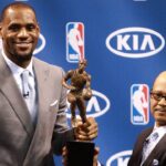 The Miami Heat s Lebron James attends a press conference for his being named the NBA s Most Valuable Player at American Airlines Arena in Miami, Florida, Saturday, May 12, 2012. Percy D. Vaughn, Regional Director for Kia Motor America, holds the MVP trophy with James.