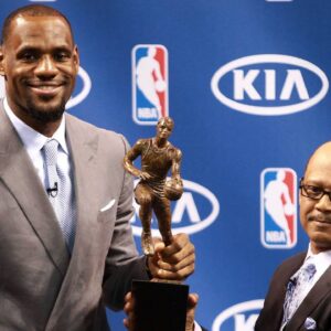 The Miami Heat s Lebron James attends a press conference for his being named the NBA s Most Valuable Player at American Airlines Arena in Miami, Florida, Saturday, May 12, 2012. Percy D. Vaughn, Regional Director for Kia Motor America, holds the MVP trophy with James.
