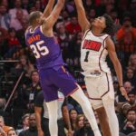Phoenix Suns forward Kevin Durant (35) makes a three point basket against Houston Rockets forward Amen Thompson (1) in the second half at Toyota Center.