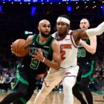 Boston Celtics guard Derrick White (9) controls the ball while New York Knicks guard Miles McBride (2) defends in the second half during game five of the second round for the 2025 NBA Playoffs at TD Garden.