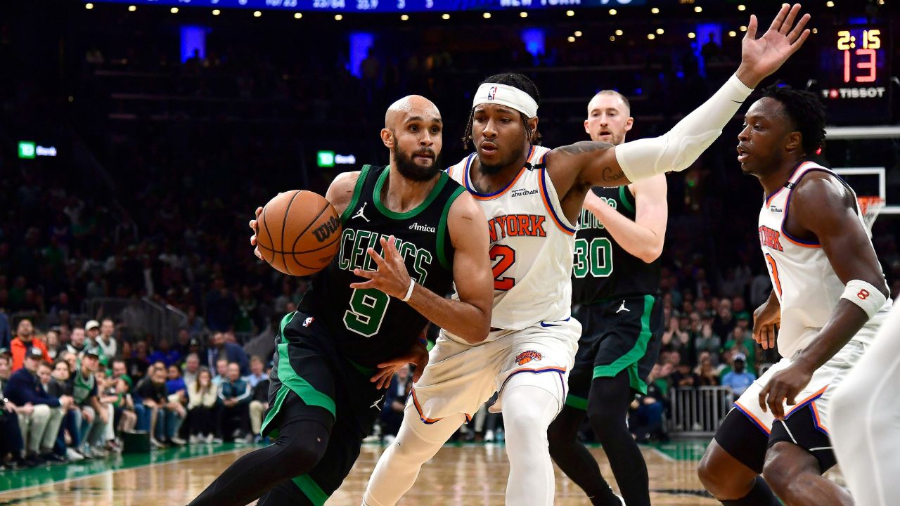 Boston Celtics guard Derrick White (9) controls the ball while New York Knicks guard Miles McBride (2) defends in the second half during game five of the second round for the 2025 NBA Playoffs at TD Garden.