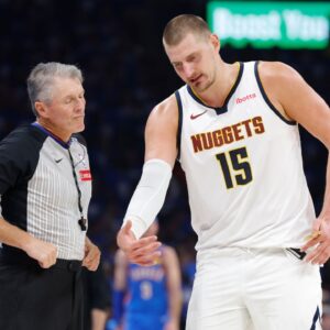 Denver Nuggets center Nikola Jokic (15) talks to an official during a break in play against the Oklahoma City Thunder in the second quarter during game seven of the second round for the 2025 NBA Playoffs at Paycom Center