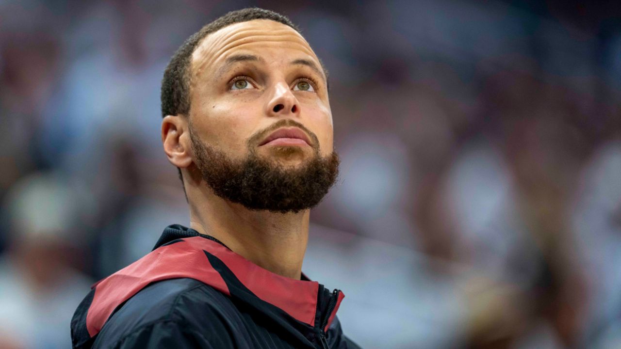 Golden State Warriors guard Stephen Curry (30) looks on from the bench against the Minnesota Timberwolves in the second half during game two of the second round for the 2025 NBA Playoffs at Target Center.