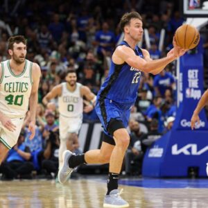 Orlando Magic forward Franz Wagner (22) passes the ball against the Boston Celtics in the second quarter during game four of first round for the 2025 NBA Playoffs at Kia Center.