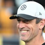 Pittsburgh Steelers quarterback Aaron Rodgers (8) watches introductions during a game against the Tampa Bay Buccaneers at Acrisure Stadium.