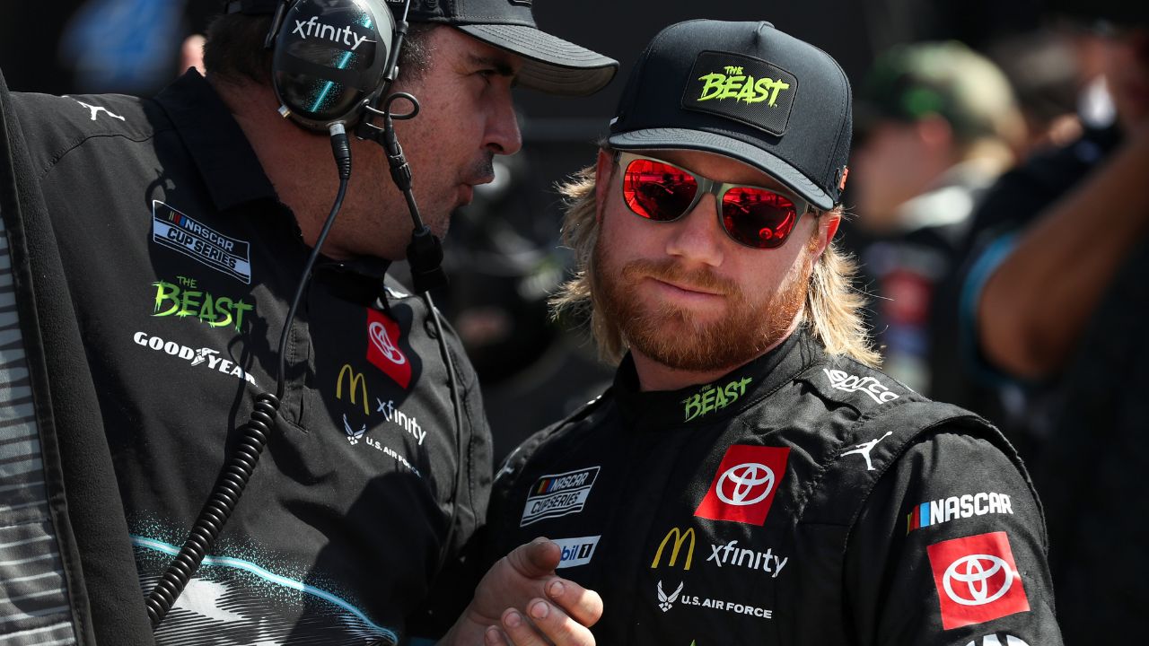 NASCAR Cup Series driver Tyler Reddick (right) talks with a crew member during practice and qualifying for the Go Bowling at The Glen at Watkins Glen International.