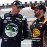 NASCAR Cup Series driver Kyle Busch (left) talks with driver Austin Dillon (right) on pit road during practice and qualifying for The Great American Getaway 400 at Pocono Raceway.