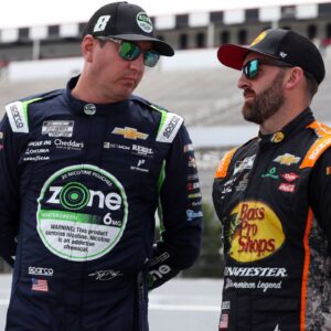 NASCAR Cup Series driver Kyle Busch (left) talks with driver Austin Dillon (right) on pit road during practice and qualifying for The Great American Getaway 400 at Pocono Raceway.
