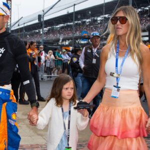 Indycar Series driver Kyle Larson holds son Cooper Larson as he walks with daughter Audrey Larson, wife Katelyn Larson and son Owen Larson prior to the 108th running of the Indianapolis 500 at Indianapolis Motor Speedway.