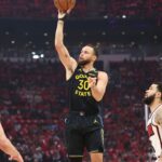 Golden State Warriors guard Stephen Curry (30) shoots the ball during the first quarter of game seven of the first round for the 2025 NBA Playoffs against the Houston Rockets at Toyota Center.