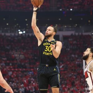 Golden State Warriors guard Stephen Curry (30) shoots the ball during the first quarter of game seven of the first round for the 2025 NBA Playoffs against the Houston Rockets at Toyota Center.
