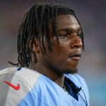 Tennessee Titans quarterback Cam Ward (1) watches from the sidelines during the third quarter of an NFL pre-season game against the Minnesota Vikings at Nissan Stadium in Nashville, Tenn., Friday, Aug. 22, 2025.