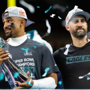Philadelphia Eagles quarterback Jalen Hurts (left) and head coach Nick Sirianni celebrate with the Vince Lombardi Trophy after defeating the Kansas City Chiefs during Super Bowl LIX at Ceasars Superdome.